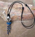 A mini silver hand charm with blue lápiz stones necklace