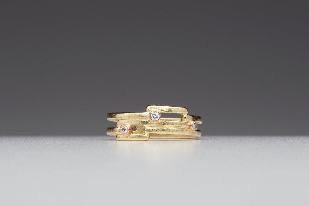 Geometry Perfected: Three-Diamond Yellow Gold Ring picture