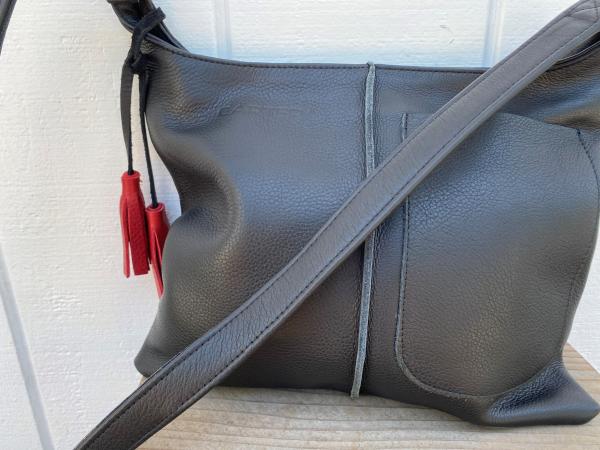 Crossbody, Black leather with black strap and Exterior pocket (zipper) picture