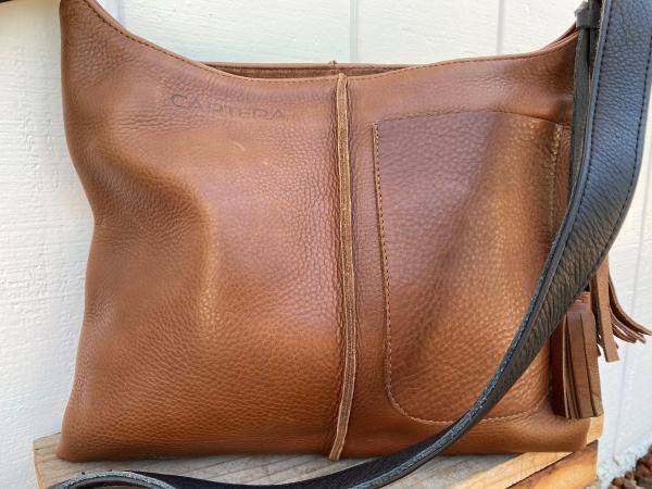 Crossbody, Brown leather with black strap and Exterior pocket (zipper) picture