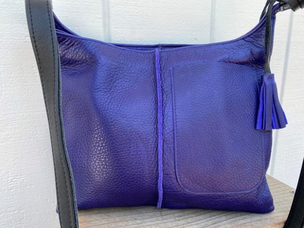 Crossbody, Purple leather with black strap and Exterior pocket (zipper) picture