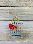 Birdcage ornament made from recycled Aluminum Cans