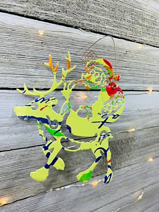 Santa Riding a Reindeer Ornament made from Recycled Aluminum Can picture