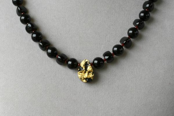 Cosmic Glow Necklace in 23-Karat Gold Leaf on Tektite Stone, Onyx, Red Seed Beads, 14-Karat Gold-Filled Toggle Clasp picture