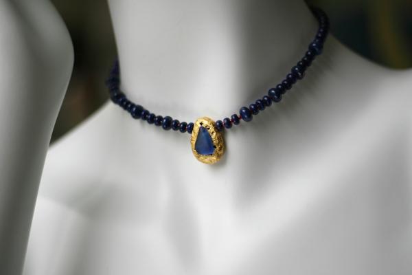 "Lapis Magic" Choker Length Necklace - Lapis Lazuli Saucer Beads, Red Seed Beads, 23-Karat Gold on Lava Nugget, Tumbled Blue Glass, Toggle Clasp picture