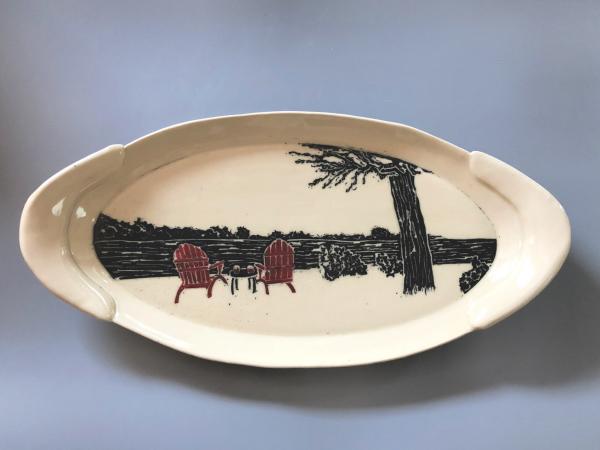 Hand carved, hand painted, hand built, ceramic platter with a pair of Adirondack chairs awaiting you