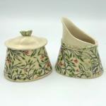 Ceramic sugar bowl and cream pitcher in adorable floral pattern