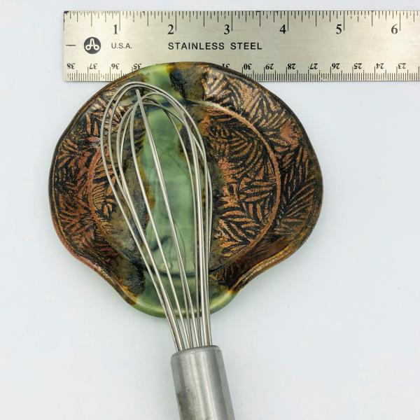 Ceramic spoon rest with gorgeous copper edges and colorful strip in the center. picture