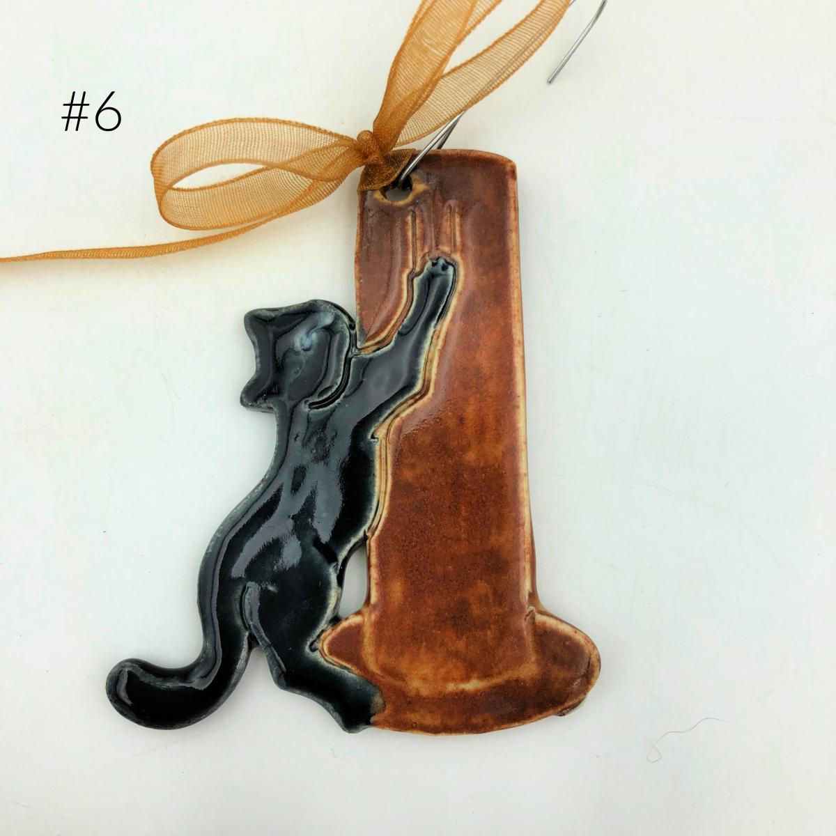 Adorable Cat with Scratching Post picture