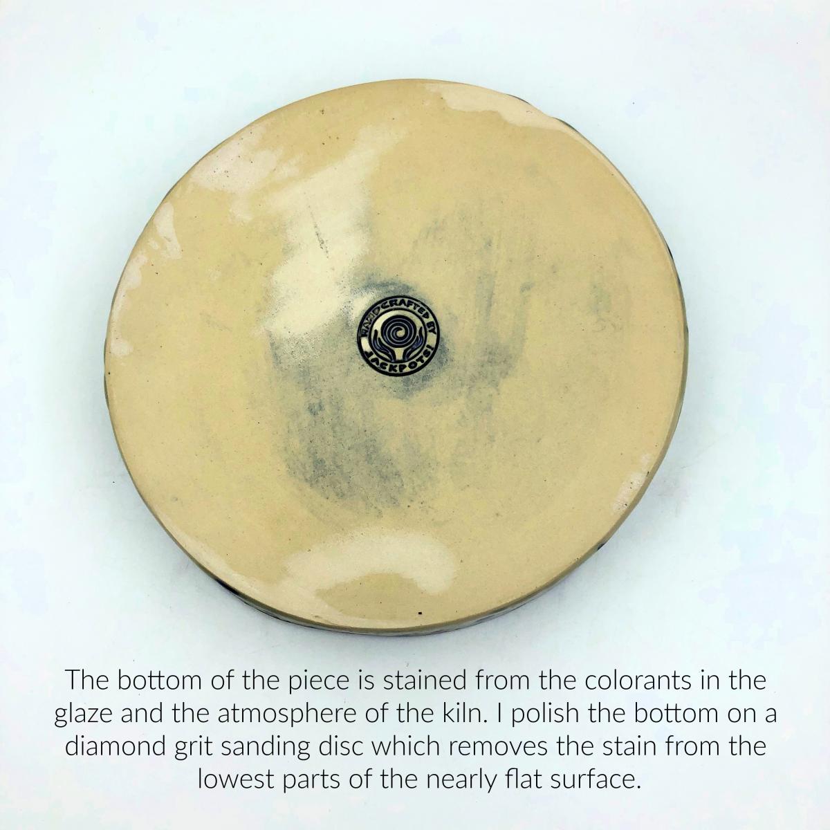 Handbuilt cake pan with rich cobalt glaze inside and blue floral pattern outside. picture