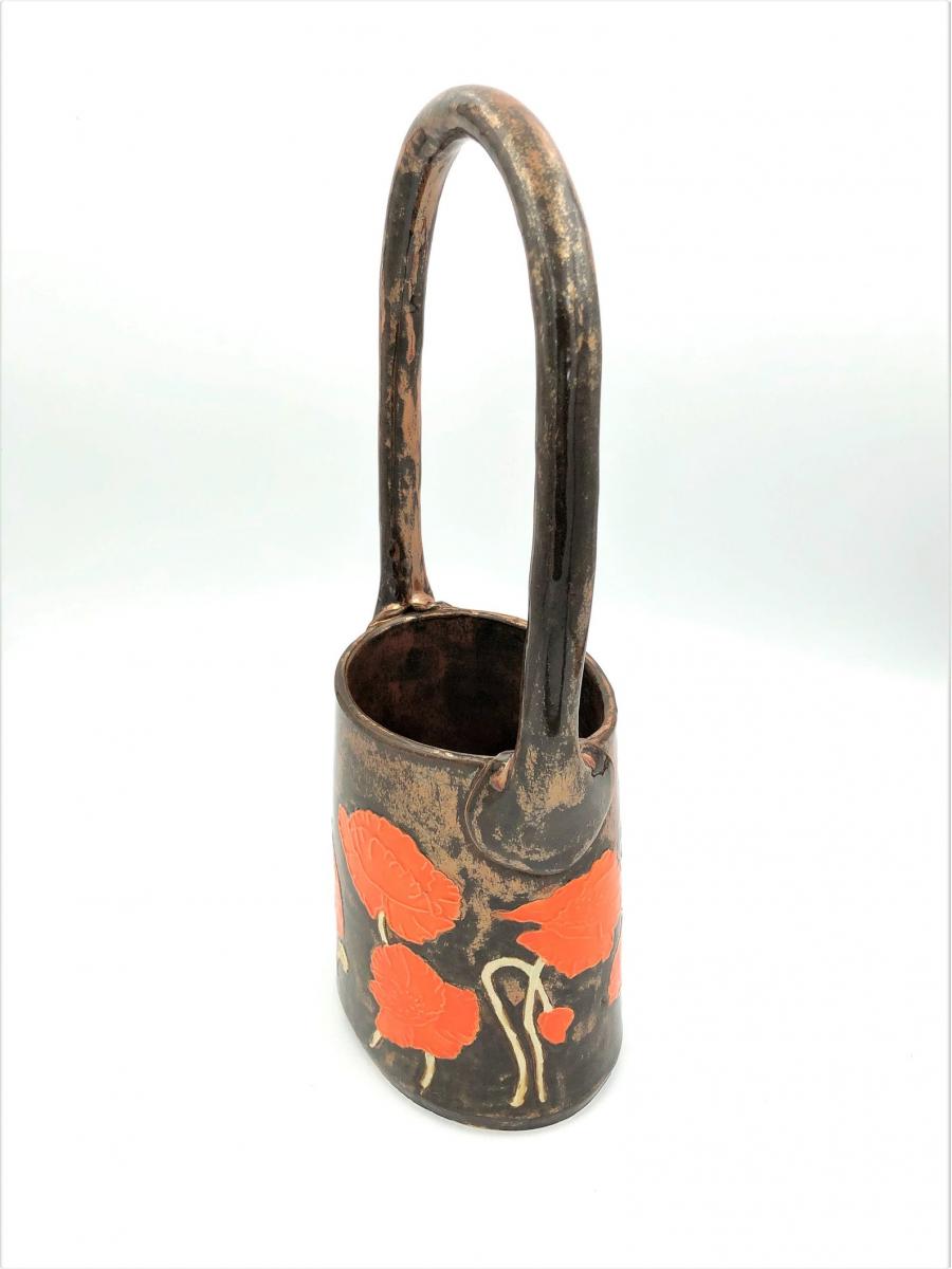 Large ceramic basket vase with bright orange poppies and shiny copper glaze picture