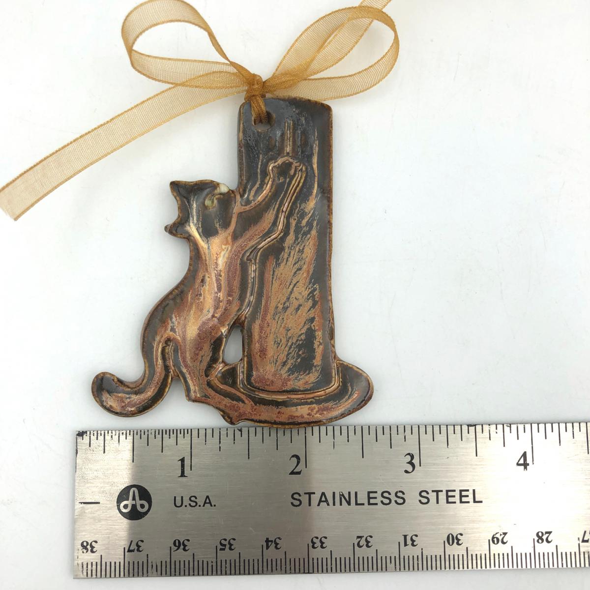 Adorable Cat with Scratching Post picture