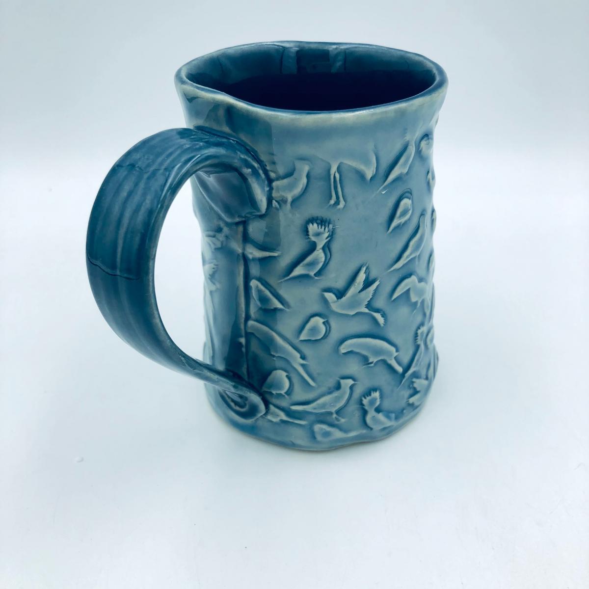 Ceramic coffee cup  textured  overall with Birds picture