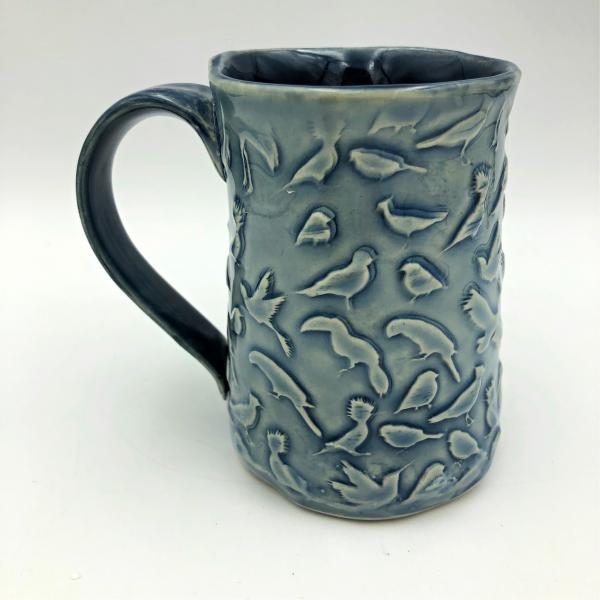 Ceramic coffee cup  textured  overall with Birds picture