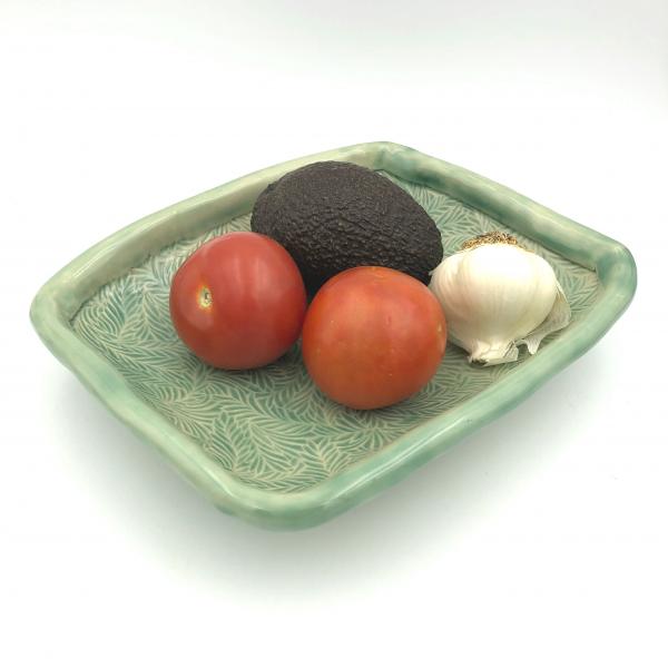 Handbuilt ceramic serving bowl with lovely, subtle texture, rolled edge and added feet.