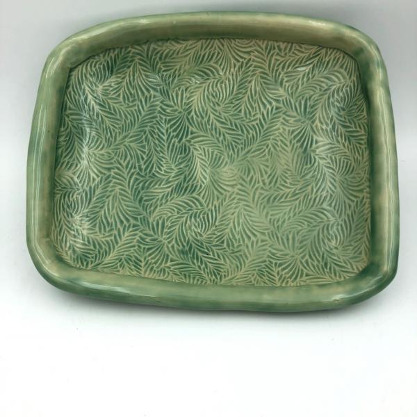 Handbuilt ceramic serving bowl with lovely, subtle texture, rolled edge and added feet. picture