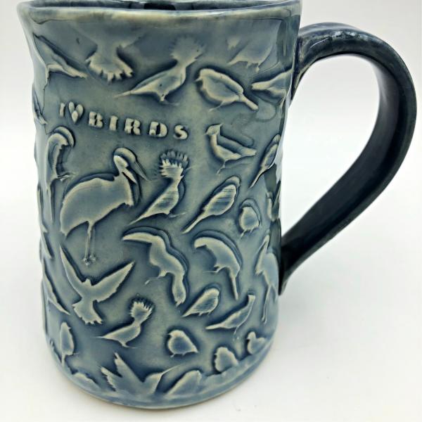 Ceramic coffee cup  textured  overall with Birds picture