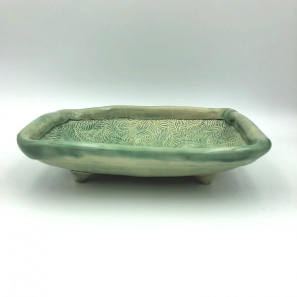 Handbuilt ceramic serving bowl with lovely, subtle texture, rolled edge and added feet. picture