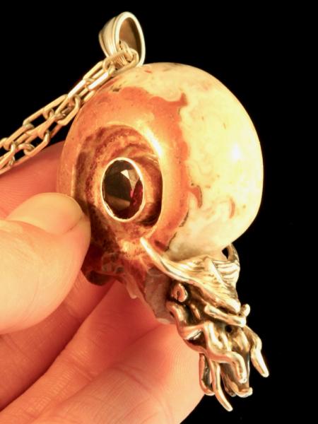 Carved Skull and Nautilus Pendant with Garnet - Silver picture