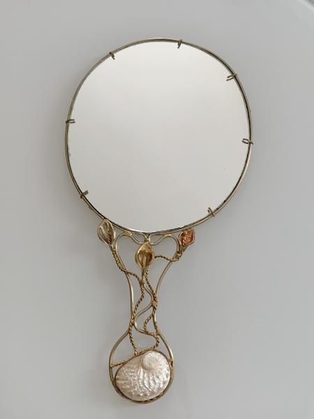Hand mirror with white shell