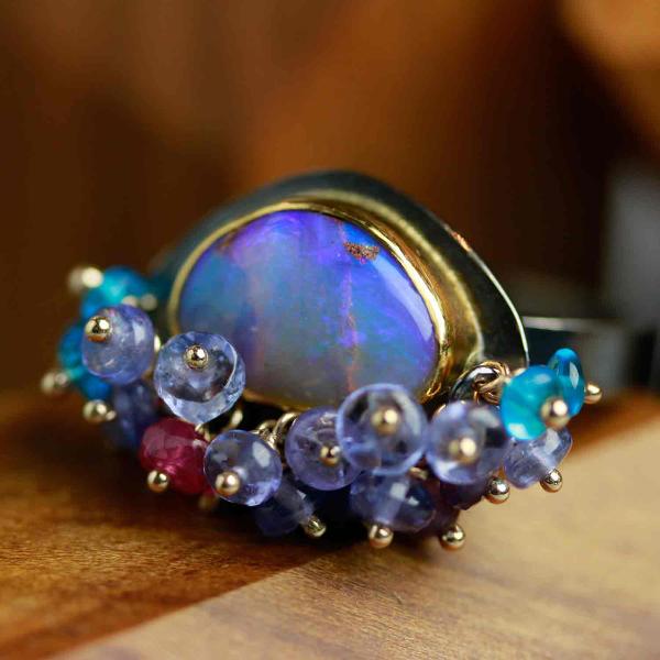 Queensland Pipe Opal with Undersea Ridges and Tanzanite Fringe. Ring Size 8 1/2. picture