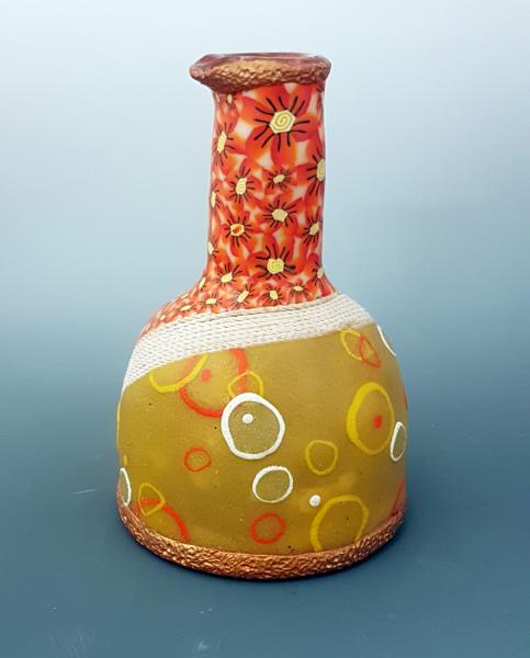 Vase with orange flowers picture