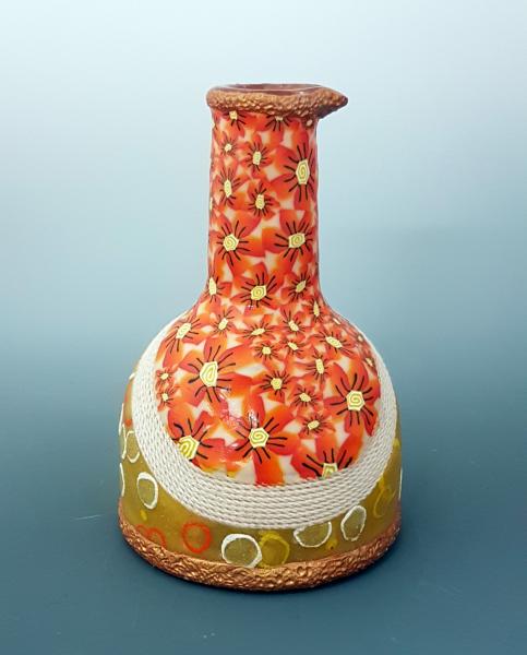 Vase with orange flowers picture