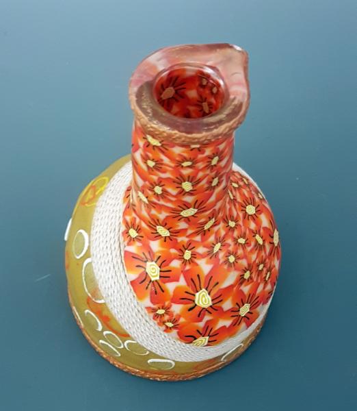 Vase with orange flowers picture