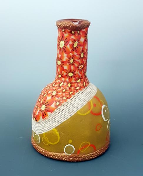 Vase with orange flowers picture