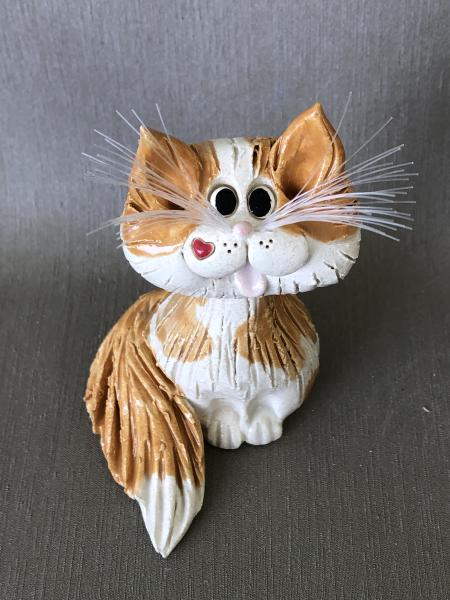 Orange tabby texture cat figurine picture