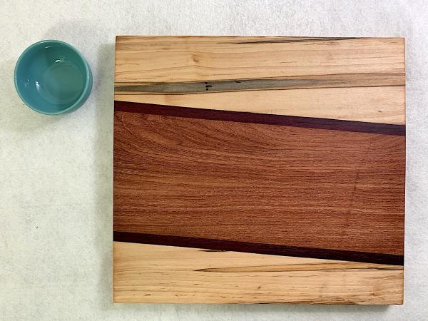 Maple Abrosia, Purpleheart, Sapele Cutting Board with Turquoise Stoneware Bowl picture