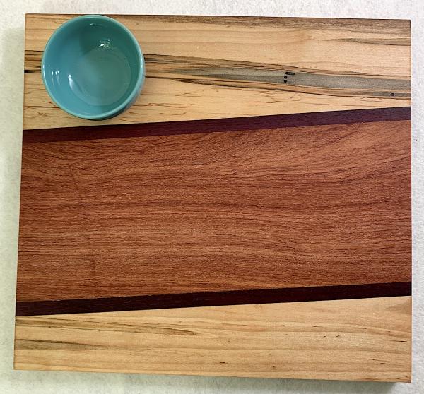 Maple Abrosia, Purpleheart, Sapele Cutting Board with Turquoise Stoneware Bowl picture