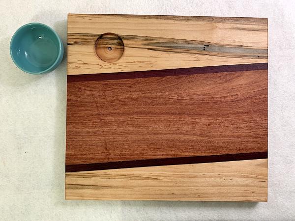 Maple Abrosia, Purpleheart, Sapele Cutting Board with Turquoise Stoneware Bowl picture