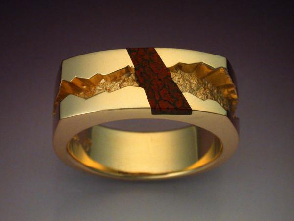 Man's ring inalid with gem Dinosaur Bone picture