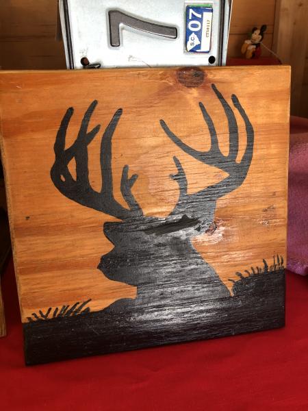 Wood sign with outline deer picture