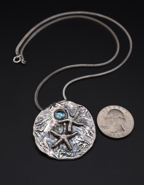 Sand Dollar with Starfish and Blue Topaz picture