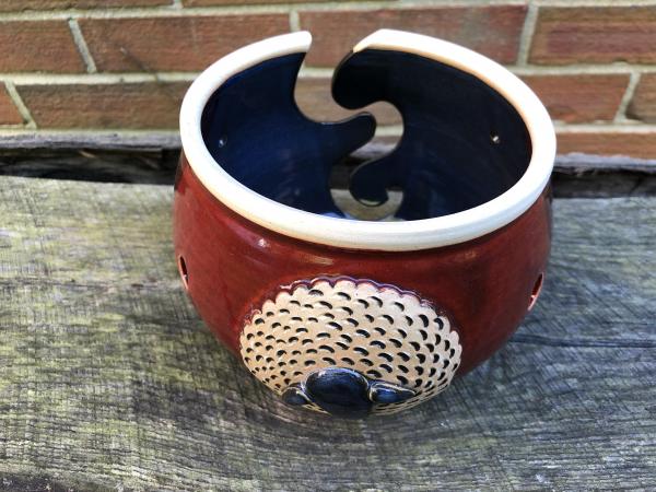 Red Yarn Bowl With a Sheep Icon 1 picture