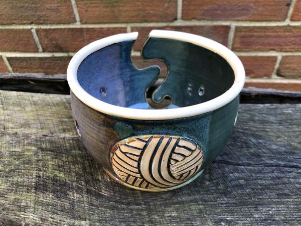 Green and Blue Yarn Bowl With a Ball of Yarn Image 1 picture