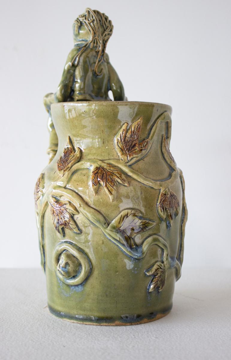 Green Vase with Seated Figure picture