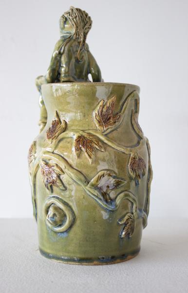 Green Vase with Seated Figure picture