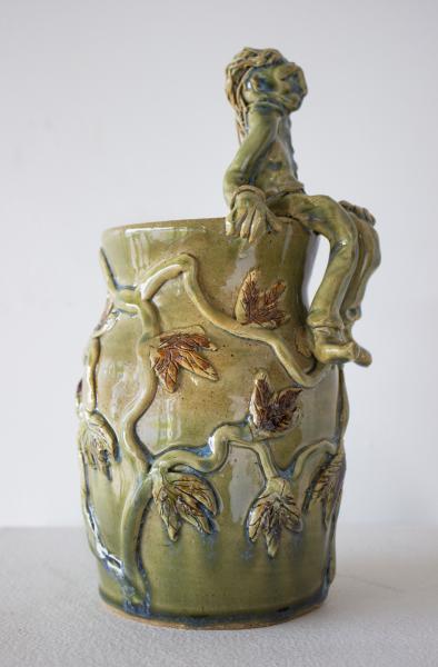 Green Vase with Seated Figure picture