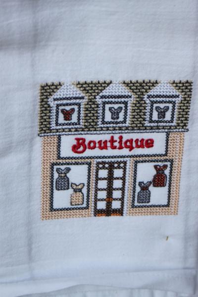 Boutique Store in a cross stitch style embroidered on a white tea towel, dish towel, flour sack, cotton, large picture
