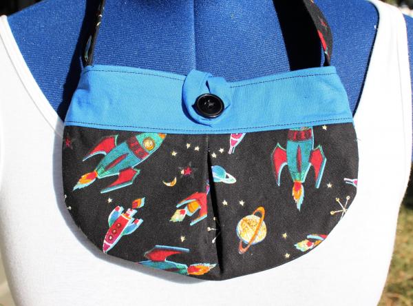 Soar to the stars with this Little girl pleated retro rocket fabric purse  Small bag, child sized.  Lined in Coordinated cotton picture