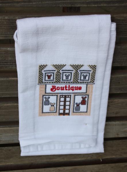 Boutique Store in a cross stitch style embroidered on a white tea towel, dish towel, flour sack, cotton, large picture