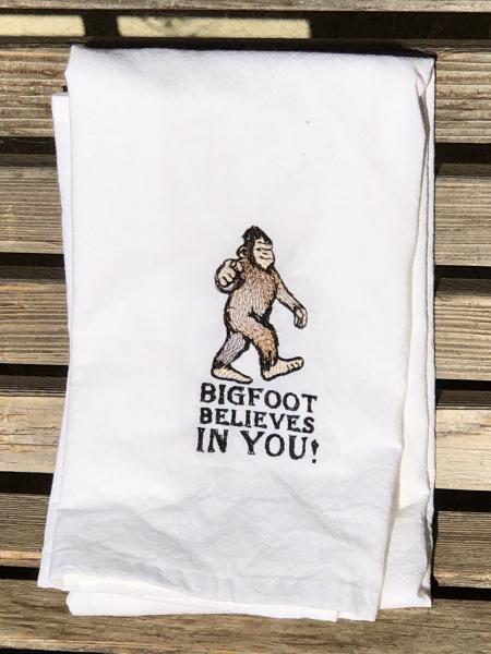 Bigfoot believes in you is embroidered on a white flour sack tea towel, dish towel, cotton picture