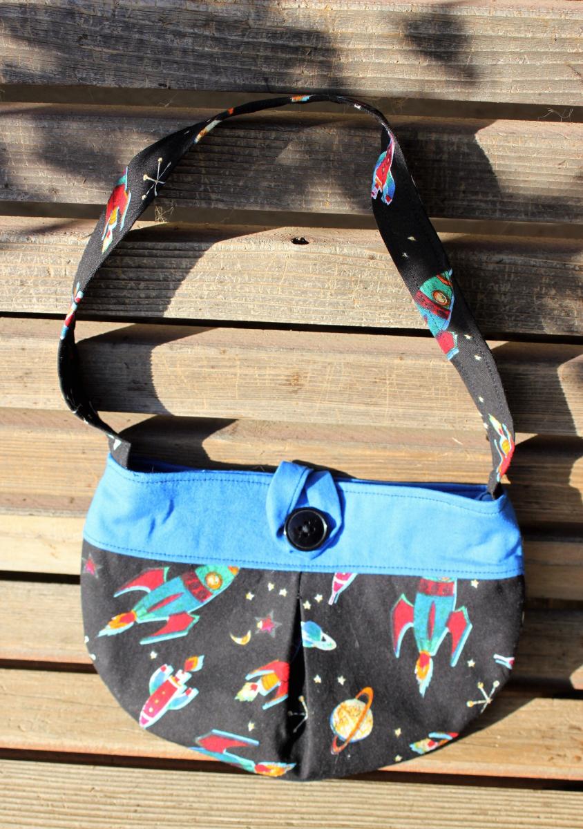 Soar to the stars with this Little girl pleated retro rocket fabric purse  Small bag, child sized.  Lined in Coordinated cotton picture