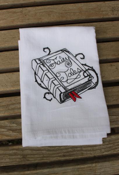 A Beautifully drawn stylized Fairy Tale Book is embroidered on a white flour sack tea towel, dish towel, cotton picture