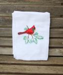 A red winter cardinal on a pine branch embroidered on a white flour sack tea towel, dish towel, cotton
