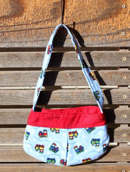 Trains small bag, child sized or small purse.  Lined in Coordinated cotton picture