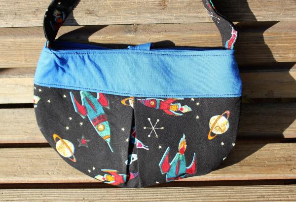 Soar to the stars with this Little girl pleated retro rocket fabric purse  Small bag, child sized.  Lined in Coordinated cotton picture